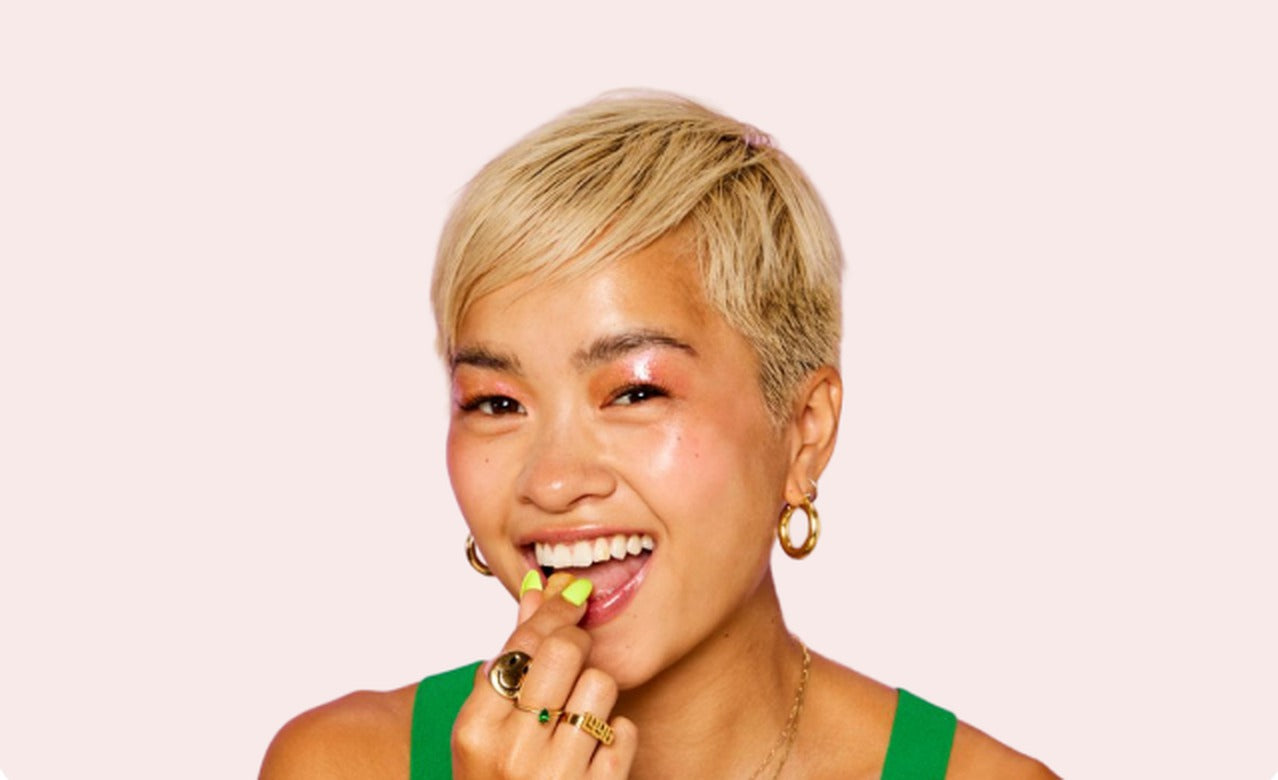 Woman enjoying a Kind Chaos gummy