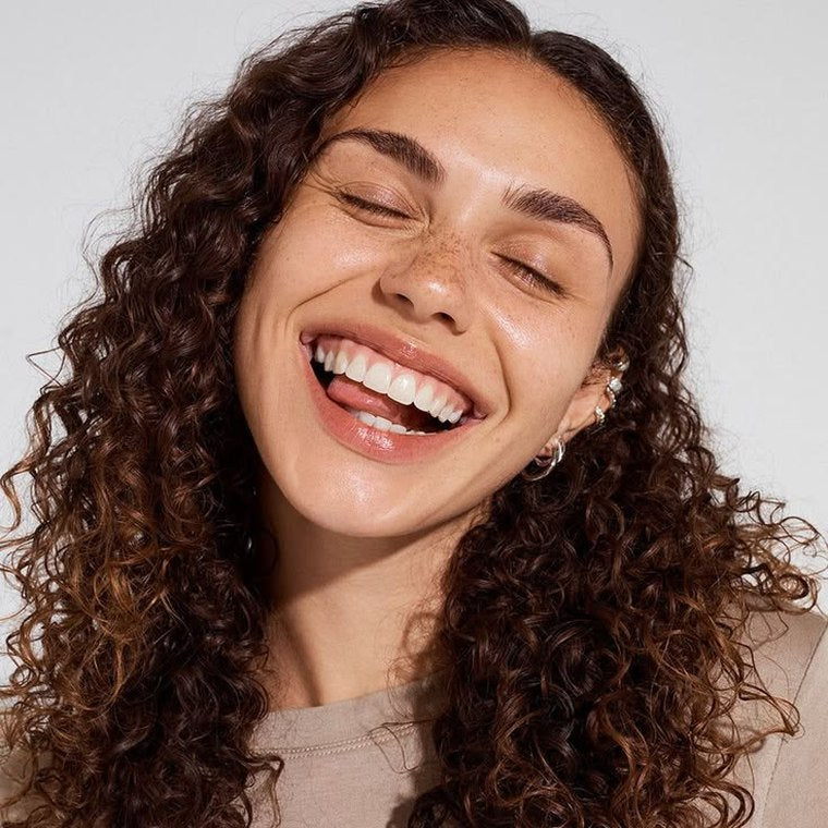 A woman smiling